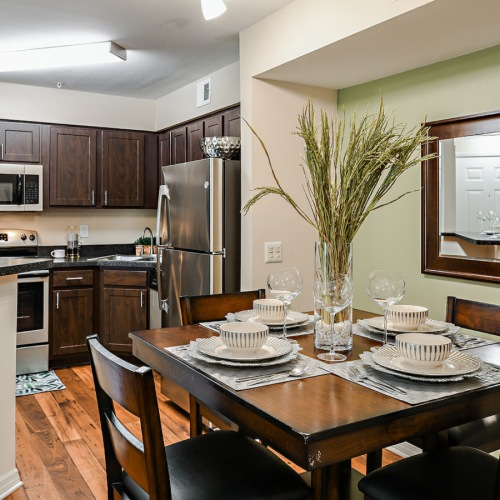 Large well lit dining area with wood floors